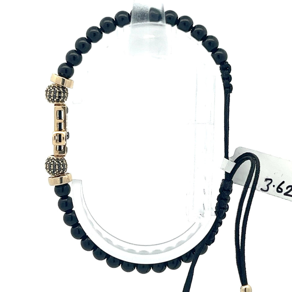 Stoffarmband mit Goldkreuz - Juwelier BenjaminStoffarmband mit Goldkreuz